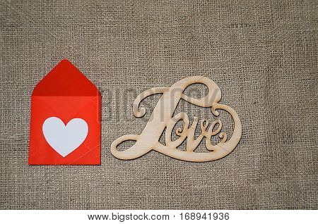 Hearts flowers ribbons on a wooden light background