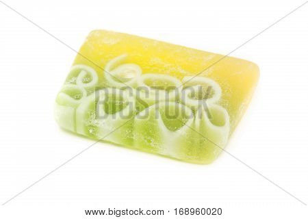 Handmade green natural soap bar over white background