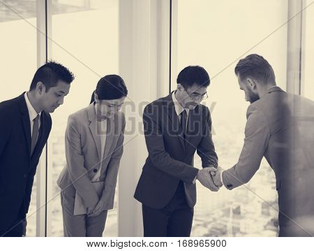 Business Partners Introductionary Handshake Bow