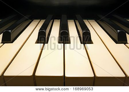 Keys of old piano, cozy place, view in perspective