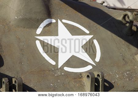 The white star on the Sherman tank in the square in Brescello.