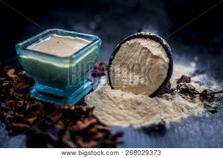 Close Up Of Popular Way Of Ex Foliating On Wooden Surface I.e. Multani  Mitti Or Fuller's Earth Well