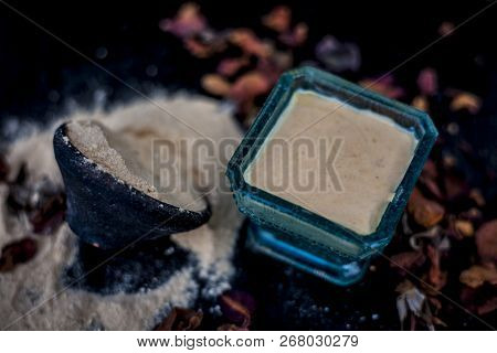 Close Up Of Popular Way Of Ex Foliating On Wooden Surface I.e. Multani  Mitti Or Fuller's Earth Well