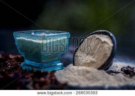 Close Up Of Popular Way Of Ex Foliating On Wooden Surface I.e. Multani  Mitti Or Fuller's Earth Well