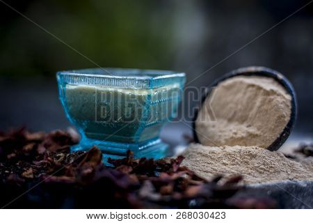 Close Up Of Popular Way Of Ex Foliating On Wooden Surface I.e. Multani  Mitti Or Fuller's Earth Well