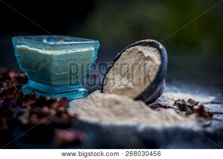 Close Up Of Popular Way Of Ex Foliating On Wooden Surface I.e. Multani  Mitti Or Fuller's Earth Well
