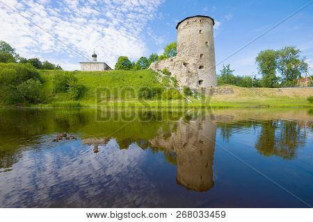 Sunny June Day On The Pskova River. View Of The Gremyachaya Tower. Pskov, Russia
