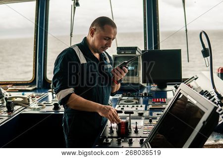 Marine Navigational Officer Is Maneuvering Ship Or Vessel
