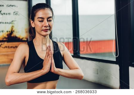 Beautiful Woman Sitting Yoga Raise Hand Before Exercise Workout On Mat