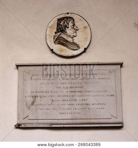 Milan, Italy-09 May 2018: Memorial Plaque On The Wall Of The Basilica Of Santambrogio. In The Church