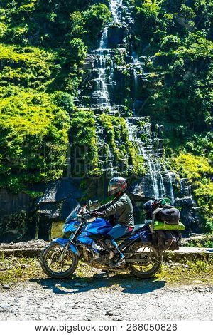 Rider At Waterfall In Darma Valley In Himalayas - Uttarakhand