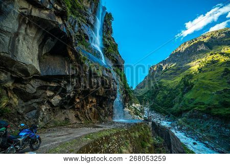Rider At Waterfall In Darma Valley In Himalayas - Uttarakhand