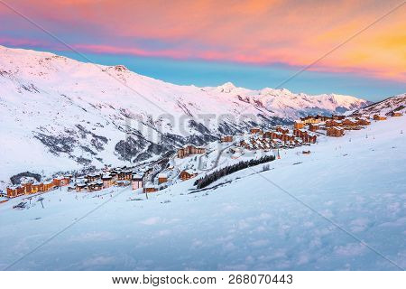 Beautiful Winter Sunrise Landscape, Famous Ski Resort With Typical Alpine Wooden Houses In French Al