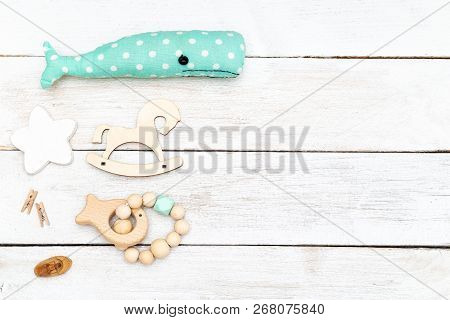 Wooden Toys And Wooden Baby Teether On Wooden Background  Copy Space