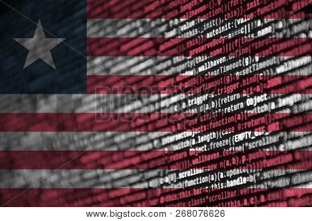 Liberia Flag  Is Depicted On The Screen With The Program Code. The Concept Of Modern Technology And 