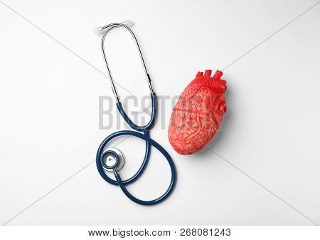 Stethoscope For Checking Pulse And Heart Model On White Background, Top View