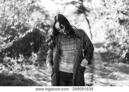Pretty Long Hair Bruntte Girl Walking In The Autumn Forest.