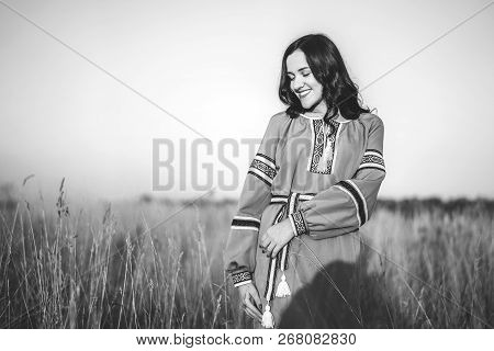 Pretty Young Brunette Girl In Long Embroidery Dress Outdoor
