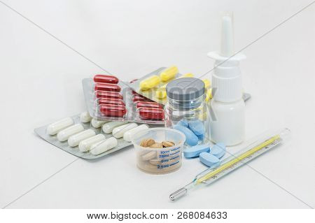 Pill Packaging And Medical Supplies Nasal Spray Mercury Termometer On White Background