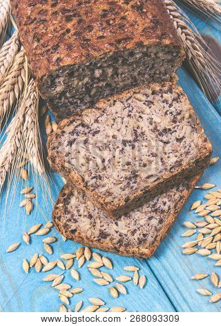 Multi-grain Bread On A Wooden Background. The Source Of Fiber, Complex Carbohydrates, B Vitamins And