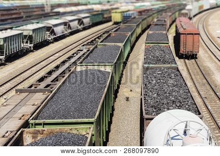 Rail Cars Loaded With Coal, A Train Transports Coal. Many Different Rail Cars.