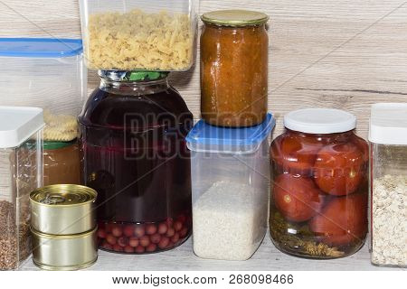 Storage Shelves In Pantry With Homemade Canned Preserved Fruits And Vegetables