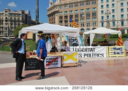 BARCELONA, SPAIN - APRIL 17, 2018: LLibertat Presos Politics (Free Political Prisoners) stands in Placa Catalunya. The campaign backs Catalan politicians jailed after the declaration of independence.