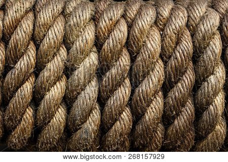 Texture Of Tightly Wound Rope Close-up. Low Key. Ideal For Background. Periodicity, Repetition, Rhyt