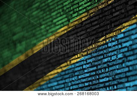 Tanzania Flag  Is Depicted On The Screen With The Program Code. The Concept Of Modern Technology And