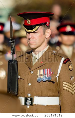 Sandhurst, United Kingdom, 11th November 2018:- A British Soldier Stands Guard At Sandhurst War Memo