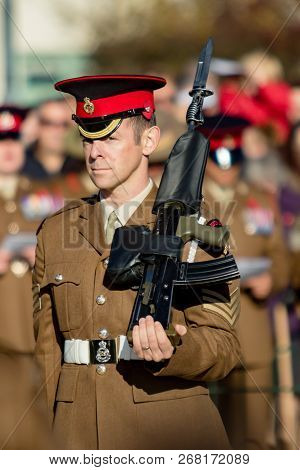 Sandhurst, United Kingdom, 11th November 2018:- A British Soldier Stands Guard At Sandhurst War Memo