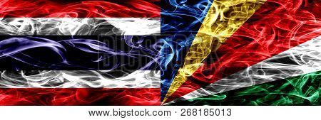 Thailand Vs Seychelles, Seychelloise Smoke Flags Placed Side By Side. Thick Abstract Colored Silky S