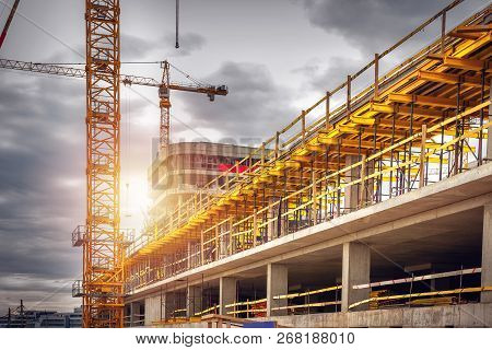 Construction Site With Crane. Building Monolite House