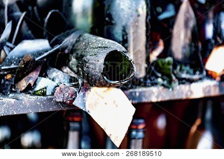 Close Up Damaged Supermarket Glass Plastic Bottles After Arson Fire With Burn Black Dark Debris Afte