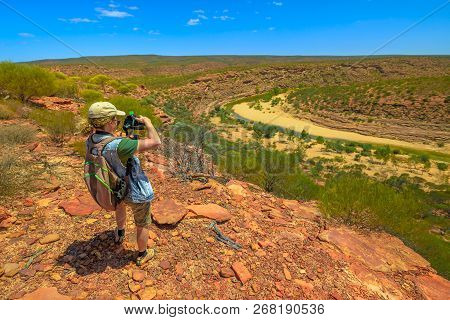 Travel Photographer Backpacker With Stabilizer Takes Shot At Murchison River Gorge In Kalbarri Natio