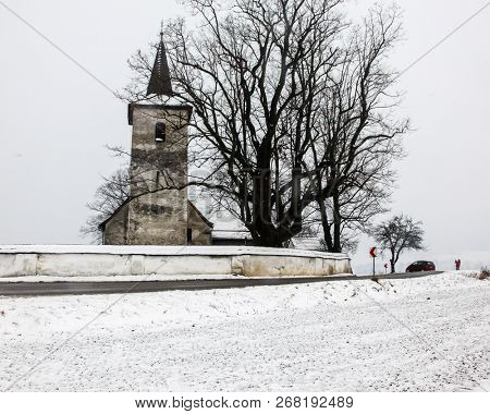 LUDROVA, SK - DECEMBER 31, 2017: All Saints church in Ludrova village, northern Slovakia. This rare Gothic church is oldest in region of Liptov.