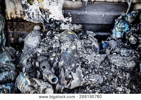 Close Up Damaged Supermarket Glass Plastic Bottles After Arson Fire With Burn Black Dark Debris Afte