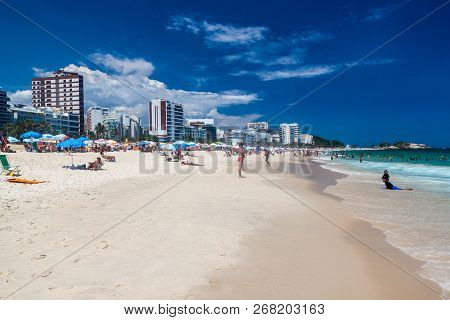 Rio De Janeiro, Brazil - January 27, 2015: People Enjoy The Famous Beach Ipanema In Rio De Janeiro.