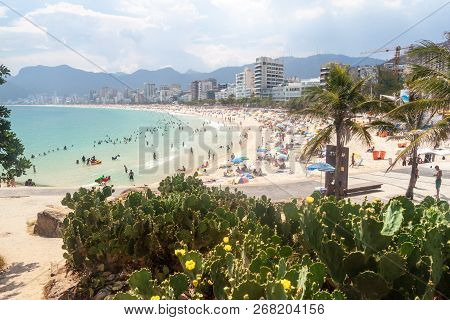 Rio De Janeiro, Brazil - January 27, 2015: People Enjoy The Famous Beach Ipanema In Rio De Janeiro.