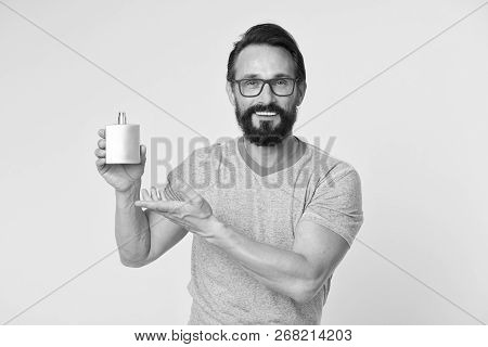 Right Perfume Fragrance Makes You Younger. Man Bearded Handsome Smiling Face Hold Bottle Perfume Def