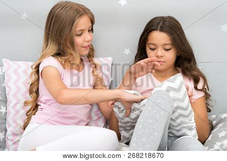 Evening Time For Fun. Girls Happy Best Friends Or Siblings In Cute Stylish Pajamas With Pillows Slee