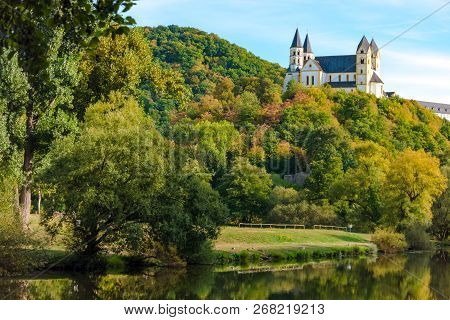 Monastery Arnstein With River Lahn In The Foreground On A Beautiful Day In Autuum
