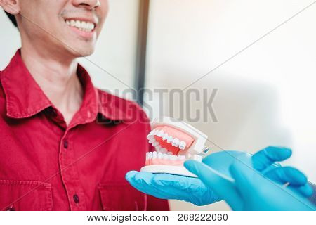 Dentist Learning How To Brush Teeth Concept