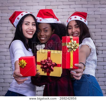 Christmas And Happiness Concept - Smiling Sandy Girl Holding Many Gift Boxes.