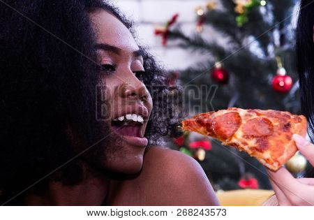 Friendship Enjoy Eating Pizza On A Table.