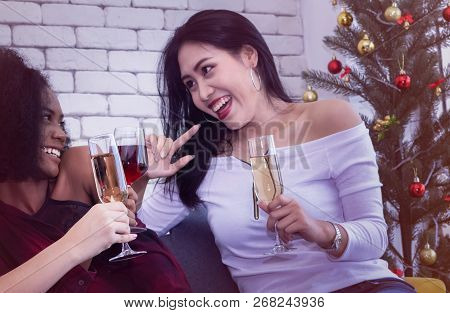 Closeup Photo Of Cheerful Girls Celebrating A Party At Home With Campaign.