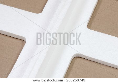 Background Image With Beige Cardboard Paper And Styrofoam Boxes Disgarded As Rubbish. The Concept Of