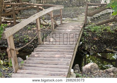 Old Vintage Wooden Bridge In A Forest