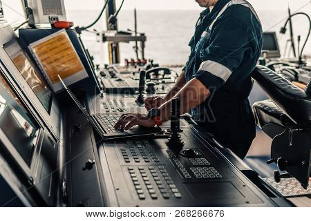 Marine Navigational Officer Is Using Laptop Or Notebook At Sea