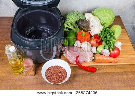 Modern Electric Automatic Household Multi-cooker With Open Lid And Empty Inner Pot Among Of Various 
